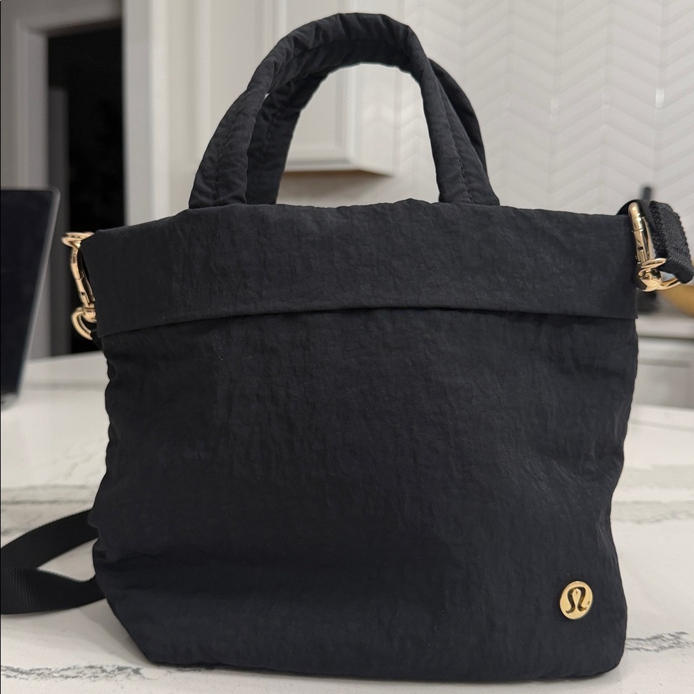 Lululemon Nylon Black Tote Crossbody Bag with gold accents.